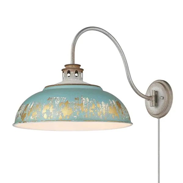 The Kinsley swing arm sconce combines rustic farmhouse elegance with practical adjustability. Its hand-painted Antique Teal shade features multi-layered distressing with chalky white and rustic gold accents, creating authentic vintage character perfect for reading nooks and task lighting.