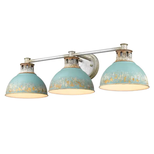 The Kinsley 3-light vanity brings authentic farmhouse charm with its heavily distressed Antique Teal metal shades and Aged Galvanized Steel frame. Each fixture is unique with multi-layered finishes revealing warm gold and off-white undertones.