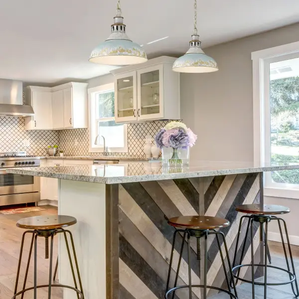 The Kinsley pendant brings artisanal farmhouse character with its heavily distressed antique teal shade revealing gold and white undertones. The aged galvanized steel frame adds industrial sophistication while remaining versatile enough for coastal and rustic interiors. - alternate view