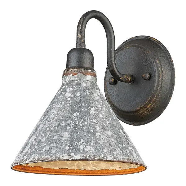 Bring rustic elegance into your home with the Wry Lighting Jasper 1-light Wall Sconce in Antique Black Iron. Featuring a metal shade and a deeply textured antique black iron frame, it creates a welcoming atmosphere. The heavily weathered galvanized steel shade showcases a mottled gray and silver exterior with chalky white speckles and rust accents, while the interior boasts a warm, antiqued golden-orange finish that softens the light and adds character. The antique black iron finish captures the raw, authentic charm of a bygone era, evoking images of time and craftsmanship. This wall sconce is perfect for enhancing hallways, stairways, and bathrooms or adding cozy ambiance in bedrooms and dining rooms. The damp location rating makes it suitable for covered and semi-enclosed spaces with occasional moisture, and installation is straightforward. Dimensions: Overall Dimensions: 7.75"W x 9.75"H x 9.5"D. Requires 1 E26 medium base bulb (not included, max 100 wattage). Embrace the charm of the farmhouse style with this artisanal fixture, celebrating craftsmanship and timeless design.
