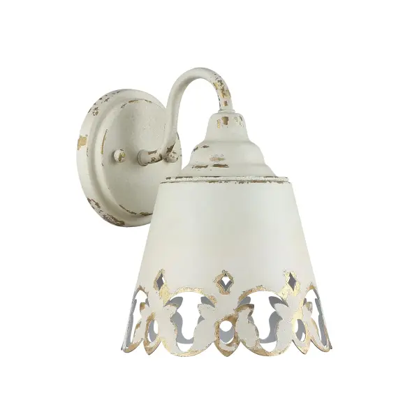 Bring farmhouse elegance into your bathroom with the Wry Lighting Eloise 1-light Vanity in Antique Ivory. Featuring a metal shade and an Antique Ivory frame, it creates a welcoming atmosphere. This metal shade, finished in a creamy, off-white base, showcases a beautiful cracked texture that allows for warm light diffusion. Each piece is hand-painted, featuring exquisite details that emphasize its artisanal craftsmanship, ensuring a unique character in every fixture. Damp location rated, this vanity light is ideal for bathrooms, covered porches, and laundry rooms, providing complimentary task illumination. Designed for simplicity, it does not require additional installation adjustments, ensuring functionality and style. Overall Dimensions: 7.5"W x 10"H x 8.75"D. Requires 1 E26 Medium base bulb (not included), with a maximum of 100 watts per bulb. Transform your bathroom with this charming fixture, blending practicality with timeless décor quality and an inviting touch. Collection: Eloise Finish: Antique Ivory Glass: Antique Ivory Width: 7.50" Height: 10.00" Weight: 2.20 lb Extension from Wall: 8.75" Canopy: 5.25"W x 5.25"H x 0.88"D Number of Bulbs: 1 Maximum Wattage: 100.00 W Bulb Type: A19 Bulb Base: E26 Light Source: Incandescent Dimmable Voltage: 120.00 V Country of Origin: China Safety Listing: ETL Manufacturer Warranty: 1 Year Limited - alternate view