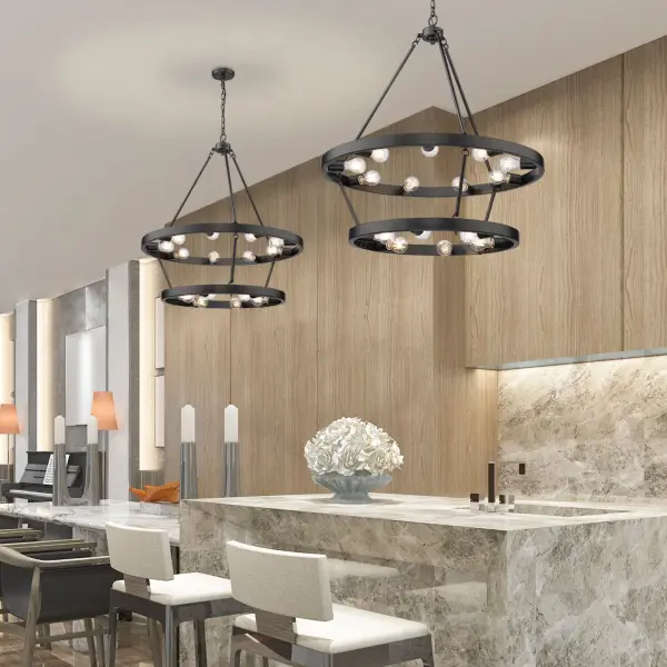 The Castile 15-light chandelier masterfully blends transitional elegance with industrial edge. Its distinctive wagon wheel silhouette features 15 modern glass globe lights arranged in a 9+6 configuration, creating dramatic illumination perfect for large dining rooms and grand entryways. - alternate view