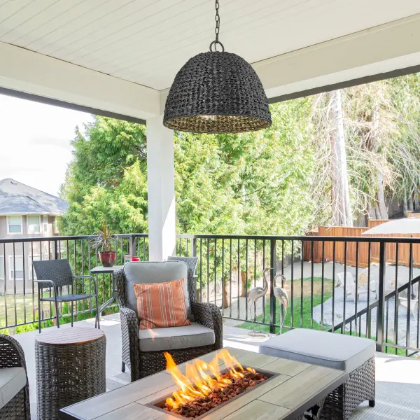 The Rue 3-Light Outdoor Pendant combines sophisticated hand-woven wicker with a Natural Black finish for a versatile fixture that transitions seamlessly from modern farmhouse to coastal styles. Wet location rated for uncovered outdoor areas. - alternate view