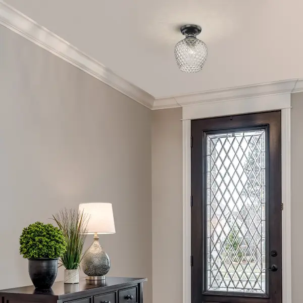 The Adeline semi-flush mount combines farmhouse elegance with modern simplicity. Its clear glass shade delivers brilliant light while the matte black frame adds graphic appeal. Damp-rated for versatile placement. - alternate view