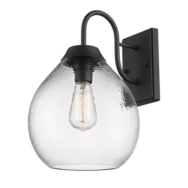 The Ariella outdoor wall sconce combines transitional elegance with durability. Its hammered glass shade creates beautiful light refraction while the natural black finish offers a soft, organic look that complements modern farmhouse to industrial styles.