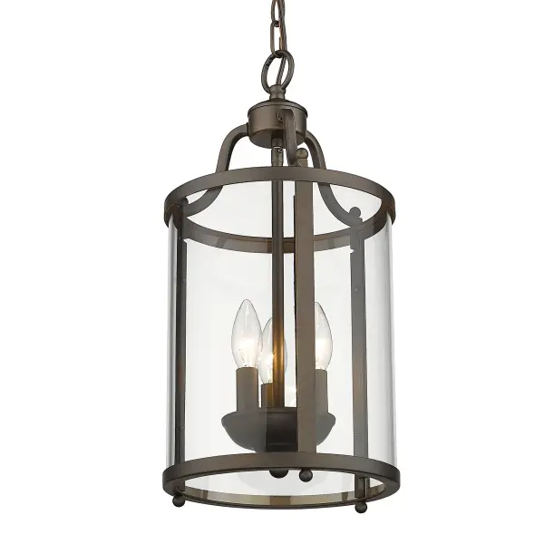 The Payton pendant delivers traditional elegance with its clear glass shades and warm Rubbed Bronze frame. Compact at 9" wide, it's perfectly sized for smaller spaces while providing ample illumination through three candelabra bulbs.