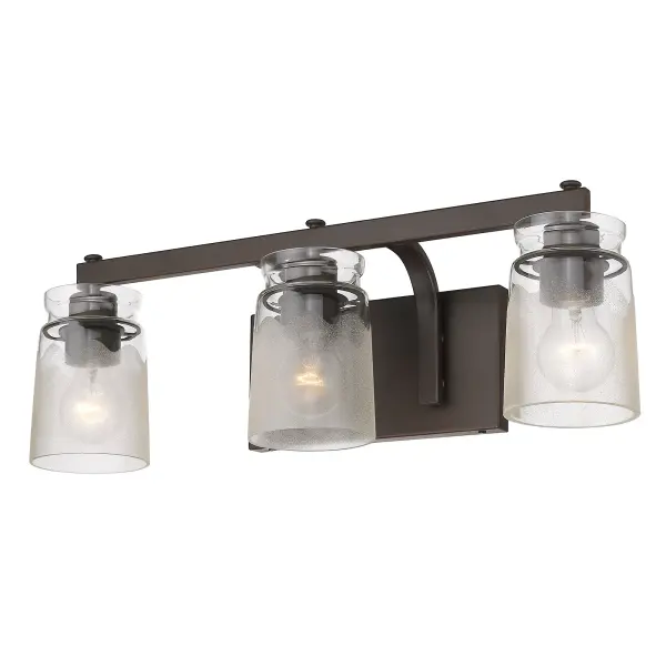 The Travers 3-light vanity combines timeless elegance with functional design. Its handcrafted clear frosted glass shades create a soft, diffused glow while the rubbed bronze finish adds classic warmth with subtle highlights.