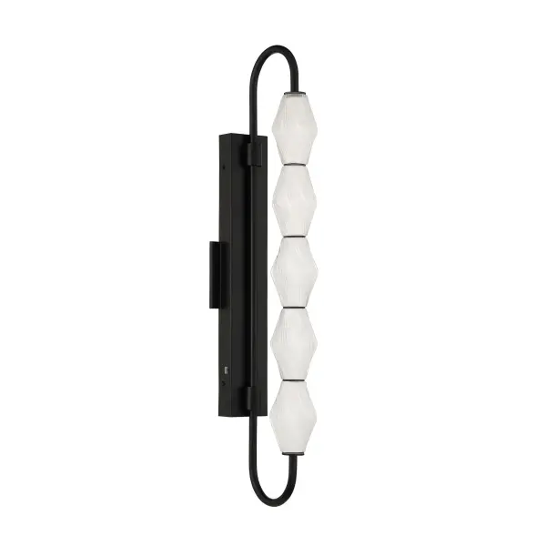The Golden Lighting Geode 32" Integrated LED Outdoor Wall Light delivers dramatic scale and modern architectural style for exterior spaces. Designed with vertically stacked fluted striped glass shades and a clean, curved Matte Black steel frame, this fixture creates a commanding vertical statement while diffusing light into a soft, inviting glow. The deep Matte Black finish offers a smooth, non-reflective surface that enhances contrast and complements a wide range of exterior materials. Measuring 8.39"W x 31.73"H x 4.72"D, this tall outdoor wall light is ideal for entryways, patios, and garage doors where both style and visibility are important. Wet-location rated to withstand rain, snow, and direct exposure to the elements, it features integrated LED technology delivering 1514 lumens of bright, energy-efficient illumination. The built-in 3CCT selector allows easy adjustment between 3000K, 4000K, and 5000K color temperatures to suit functional or ambient lighting needs. Collection: Geode Finish: Matte Black Glass: Fluted Striped Glass Width: 4.75" Height: 31.75" Weight: 8.36 lb Extension from Wall: 8.38" Canopy: 19.75"W x 1.63"H x 4.75"D Bulbs Included Number of Bulbs: 5 Maximum Wattage: 22.00 W Bulb Type: Panel Light Source: LED Dimmable Voltage: 120.00 V Country of Origin: China Safety Listing: ETL LED Manufacturer Warranty: 5 Year Limited - alternate view