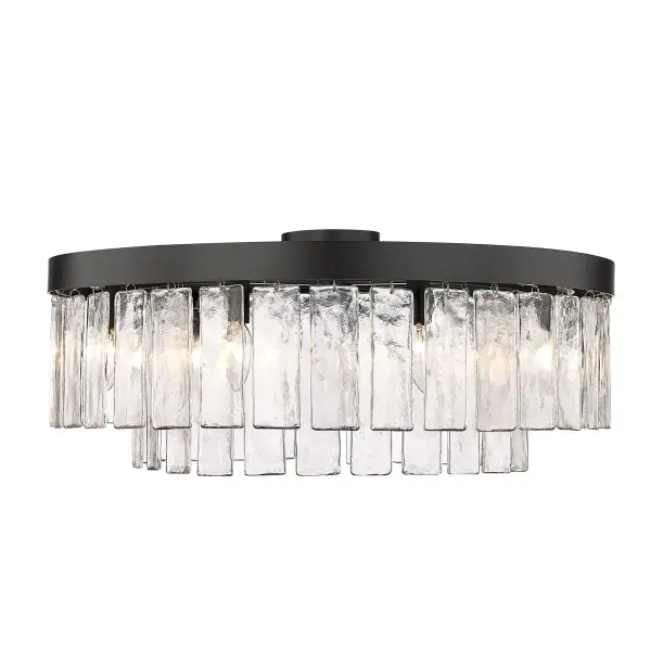 The Ciara 9-light semi-flush mount combines dramatic hammered water glass with a sophisticated matte black finish, creating intricate light patterns that elevate any space. Perfect for mid-height ceilings with convertible installation options.
