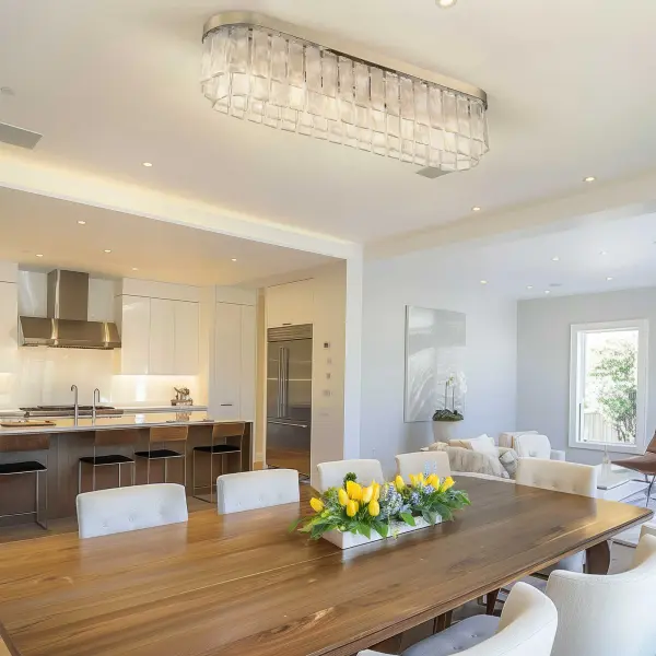The Ciara 6-light flush mount combines contemporary glam elegance with artisanal craftsmanship. Its hammered water glass shade creates a beautifully distorted light effect while the white gold finish adds warmth and sophistication. - alternate view