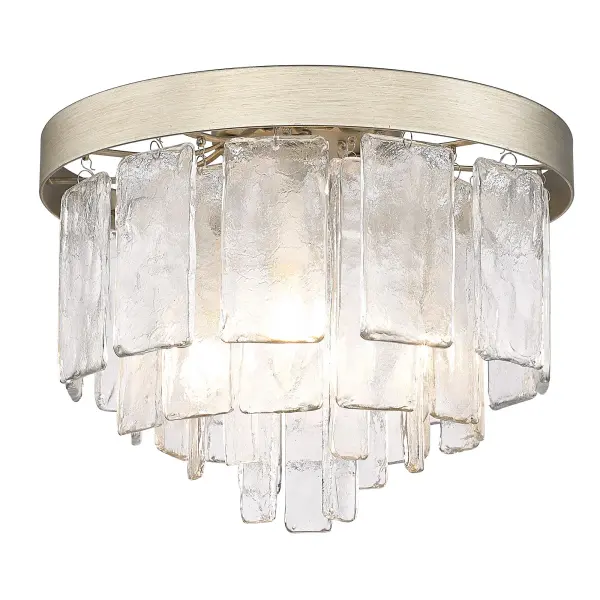 The Ciara flush mount combines sophisticated style with practical functionality. Its hammered water glass shade creates a beautiful light-distorting effect, while the distinctive White Gold finish adds warmth to modern and transitional spaces.