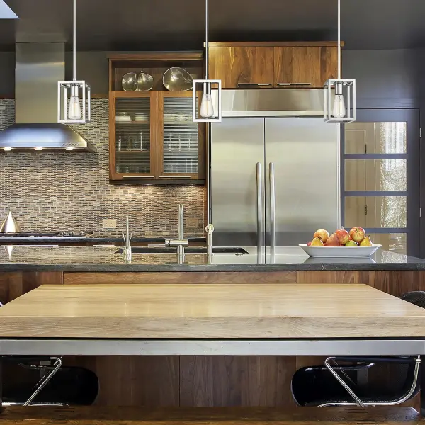 The Wesson pendant combines industrial charm with contemporary minimalism. Its open cage design showcases exposed bulbs while the brilliant chrome finish adds a clean, modern touch to any space. - alternate view