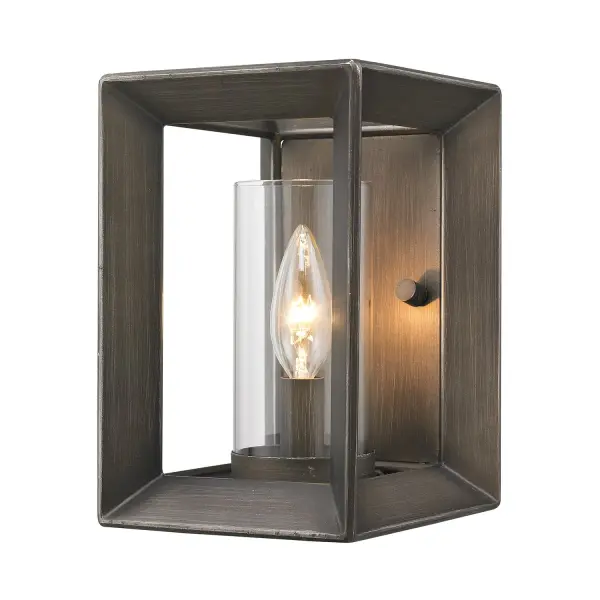 The Smyth wall sconce beautifully blends classic elegance with modern industrial design. Its clear glass shade provides brilliant illumination while the gunmetal bronze finish adds sophisticated depth to any space.
