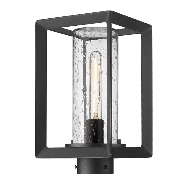 The Smyth outdoor post light combines artisanal seeded glass with a natural black finish to create warm, inviting illumination for pathways and entryways. Wet location rated for year-round durability in uncovered areas.