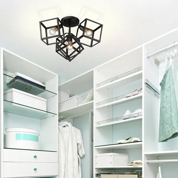 The Cassio 4-light semi-flush mount combines industrial elegance with practical versatility. Its open-frame design and exposed bulb configuration create dramatic visual impact while the matte black finish complements diverse decor styles. - alternate view