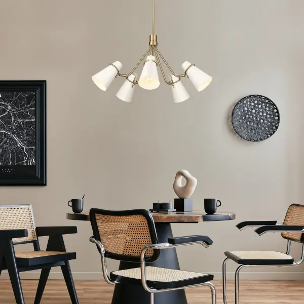 The Reeva 5-light chandelier combines timeless elegance with modern sophistication. Its warm Modern Brass finish and high-gloss Ecru metal shades create beautiful light reflection, making it a versatile statement piece for both contemporary and traditional interiors. - alternate view