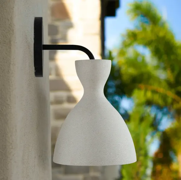 The Aethera LED Wall Sconce combines raw concrete beauty with modern functionality. Its compact 7-inch design features handcast white cement with matte black accents, integrated LED technology with 3CCT color selection, and wet location rating for versatile indoor-outdoor use. - alternate view