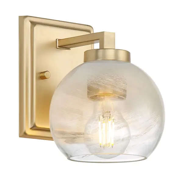 The Elliott vanity light combines Art Deco glamour with modern sophistication. Its Brushed Champagne Brass finish and Clear Alabaster glass create a soft, diffused glow perfect for bathrooms and powder rooms.