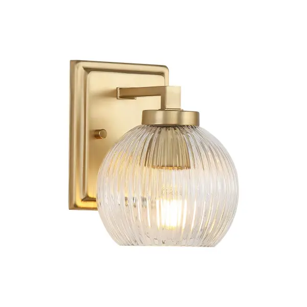 The Elliott vanity light combines vintage Art Deco charm with contemporary sophistication. Its clear ribbed glass shade creates beautiful light refraction while the brushed champagne brass finish adds understated luxury to any bathroom.