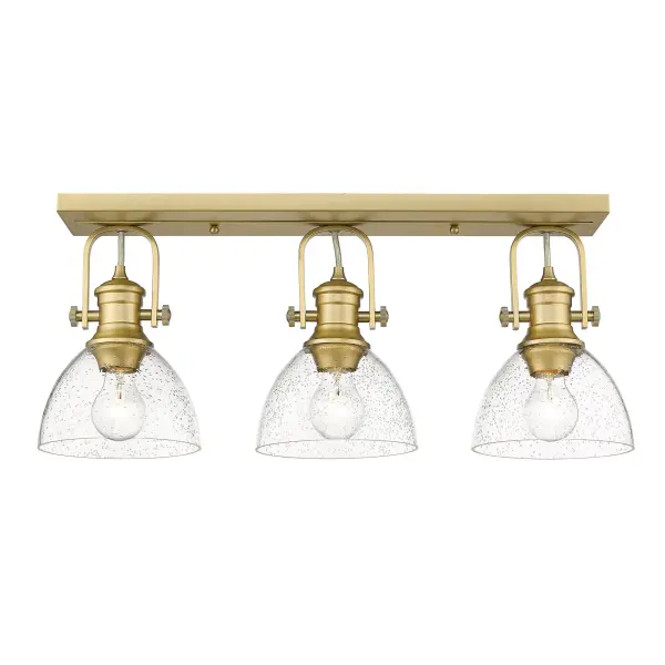 The Hines 3-Light Semi-Flush Mount combines vintage-inspired seeded glass with modern brushed champagne brass for a sophisticated look. Adjustable directional heads provide customizable lighting control, perfect for mid-height ceilings. - alternate view