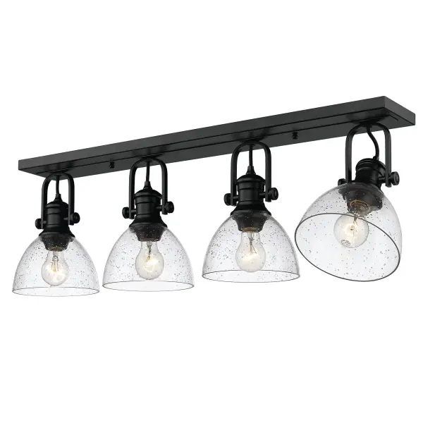 The Hines 4-light semi-flush mount combines contemporary style with farmhouse charm through its seeded glass shades and matte black finish. Adjustable directional heads provide customizable lighting, while the textured glass creates a warm, inviting glow.