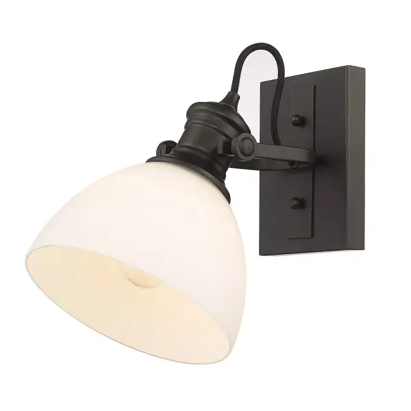 The Hines 1-Light Vanity combines traditional elegance with modern functionality. Its Rubbed Bronze finish and Opal Glass shade create a warm, inviting atmosphere perfect for bathroom vanities.