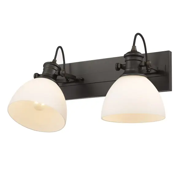 The Hines 2-Light Vanity combines farmhouse charm with practical functionality. Its Rubbed Bronze finish and Opal Glass shades create a warm, inviting glow perfect for bathroom spaces. Adjustable directional heads offer versatile lighting options.