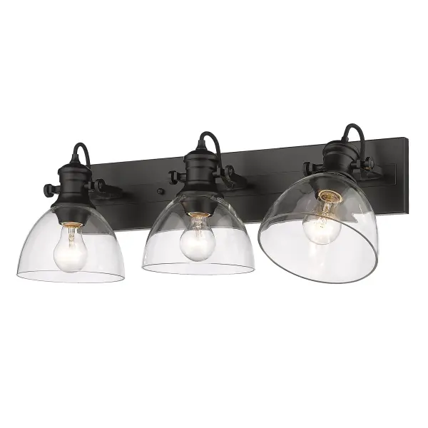 The Hines 3-Light Vanity combines sleek modern design with practical functionality. Its matte black finish and clear glass shades create a contemporary look that works across multiple decor styles. Adjustable directional heads provide customizable lighting.