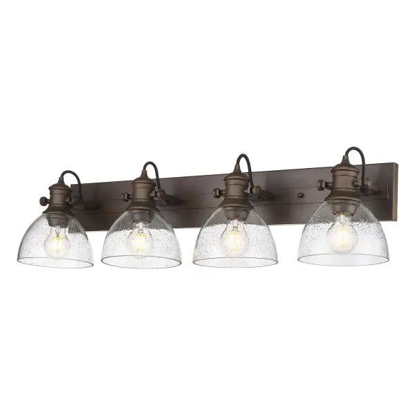 Bring traditional elegance into your home with the Yep by Golden Lighting Hines 4-light Vanity in Rubbed Bronze and Seeded Glass. Featuring a seeded glass shade and a rubbed bronze frame, it creates a welcoming atmosphere. The seeded glass shade adds a touch of vintage character, incorporating clear glass with infused bubbles that creates a unique, textured look while softly diffusing light. Our Rubbed Bronze finish brings a touch of classic warmth to any design, celebrated for its rich, deep brown base accented by gentle highlights of bronze. Ideal for brightening up bathrooms with task illumination, this fixture is damp location rated, suitable for areas with occasional moisture, and adjustable directional heads allow for customized lighting. Overall Dimensions: 34.63"W x 8.75"H x 8.25"D Requires 4 E26 Medium base bulbs (not included), max 60 watt each. This vanity light is not only a practical solution but also a stylish statement, bringing quality and charm to your space.