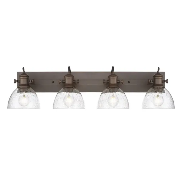 Bring traditional elegance into your home with the Yep by Golden Lighting Hines 4-light Vanity in Rubbed Bronze and Seeded Glass. Featuring a seeded glass shade and a rubbed bronze frame, it creates a welcoming atmosphere. The seeded glass shade adds a touch of vintage character, incorporating clear glass with infused bubbles that creates a unique, textured look while softly diffusing light. Our Rubbed Bronze finish brings a touch of classic warmth to any design, celebrated for its rich, deep brown base accented by gentle highlights of bronze. Ideal for brightening up bathrooms with task illumination, this fixture is damp location rated, suitable for areas with occasional moisture, and adjustable directional heads allow for customized lighting. Overall Dimensions: 34.63"W x 8.75"H x 8.25"D Requires 4 E26 Medium base bulbs (not included), max 60 watt each. This vanity light is not only a practical solution but also a stylish statement, bringing quality and charm to your space. - alternate view