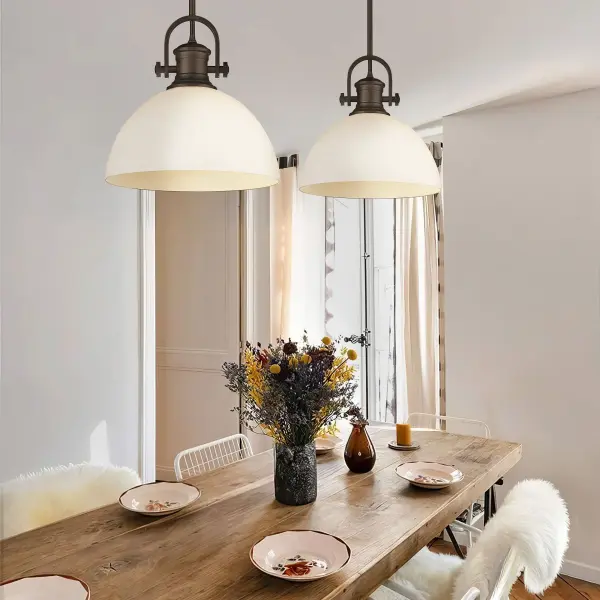 The Hines pendant combines farmhouse elegance with versatile functionality. Its opal glass shade provides soft, diffused lighting while the rich Rubbed Bronze finish adds warmth to any space. - alternate view