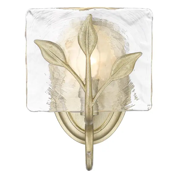 The Calla Wall Sconce brings sophisticated warmth through its unique White Gold finish and heavily textured hammered water glass shade. Perfect for creating ambient lighting in bathrooms, hallways, and dining spaces.