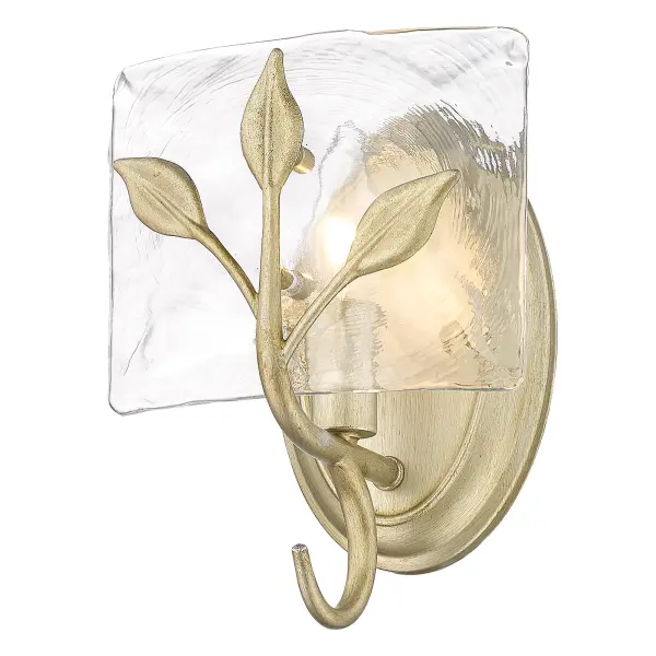 The Calla Wall Sconce brings sophisticated warmth through its unique White Gold finish and heavily textured hammered water glass shade. Perfect for creating ambient lighting in bathrooms, hallways, and dining spaces. - alternate view