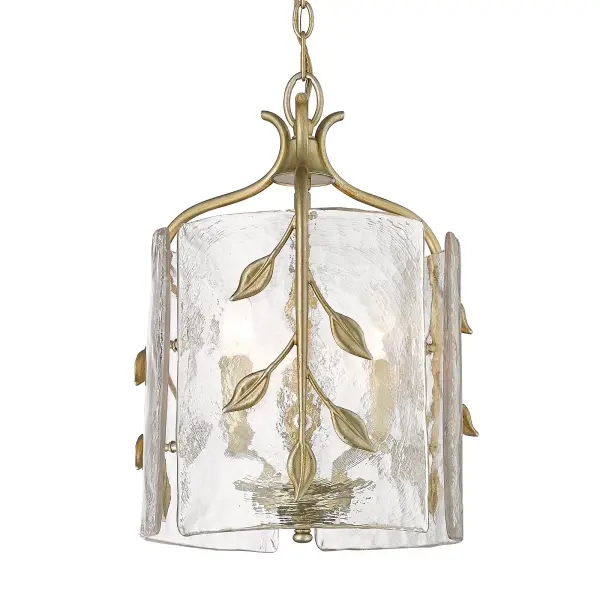 The Calla 3-Light Pendant combines industrial design with sophisticated artisanal details. Its hammered water glass shade creates dynamic light refraction while the White Gold finish adds warmth and versatility to any space.