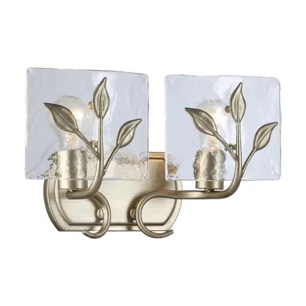 The Calla 2-Light Vanity combines artisanal craftsmanship with functional design. Its hammered water glass creates a beautifully refractive light effect, while the brushed White Gold finish adds warmth and sophistication to any bathroom space. - alternate view