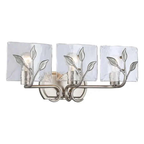 The Calla 3-Light Vanity combines rustic charm with practical illumination. Its hammered water glass shades refract light beautifully while the Peruvian Silver finish adds handcrafted character to any bathroom space. - alternate view