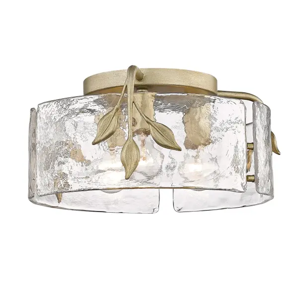 Bring Nature-Inspired elegance into your home with the Golden Lighting Calla 3-light Flush Mount in White Gold. Featuring a glass shade and a White Gold frame, it creates a welcoming atmosphere. This glass shade features Hammered Water Glass, characterized by its heavy, irregular, and organic texture, designed to create a beautifully distorted and refractive light effect. The sophisticated White Gold finish blends the warmth of gold with cool silver tones, offering an understated elegance suitable for any décor. Ideal for low ceilings in hallways, closets, and bathrooms, this fixture is Damp Location Rated, making it suitable for covered and semi-enclosed spaces with occasional moisture. Overall Dimensions: 15.13"W x 7"H x 15.13"D, requires 3 E26 Medium base bulbs (not included), max wattage 100 per bulb. Elevate your space with this artisanal lighting option that beautifully reflects quality and craftsmanship.