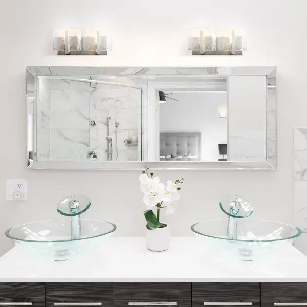 The Aenon 2-Light Vanity combines organic design with artisanal craftsmanship. Its hammered water glass creates stunning refractive light patterns while the pewter finish offers a sophisticated alternative to chrome. - alternate view