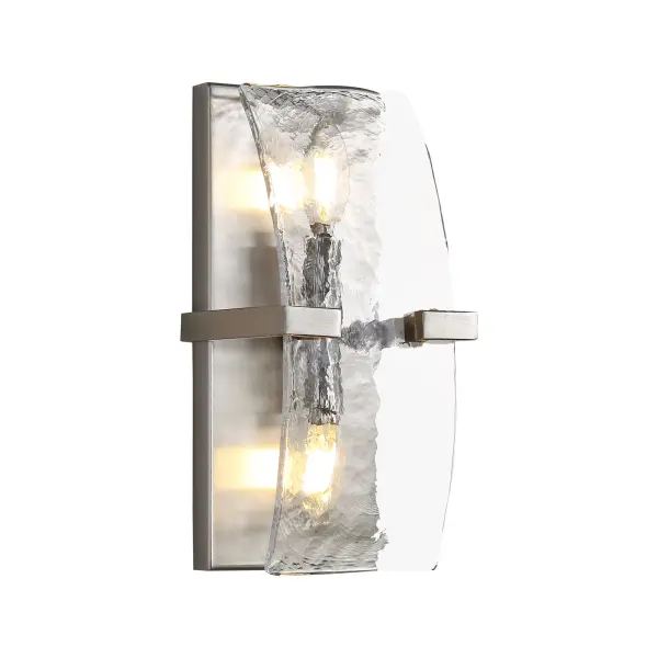 The Aenon 2-Light Wall Sconce combines handcrafted quality with organic design. Its hammered water glass shade creates beautiful light patterns while the pewter finish adds classic charm. Damp-rated for bathrooms and hallways.