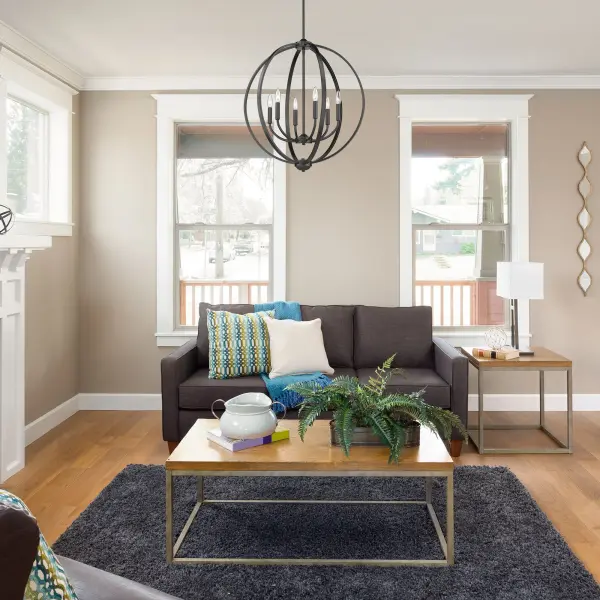 The Colson 6-Light Chandelier combines classic candelabra styling with a contemporary open-orb frame in sophisticated matte black. Its adjustable height and versatile design make it perfect for both traditional and modern spaces. - alternate view
