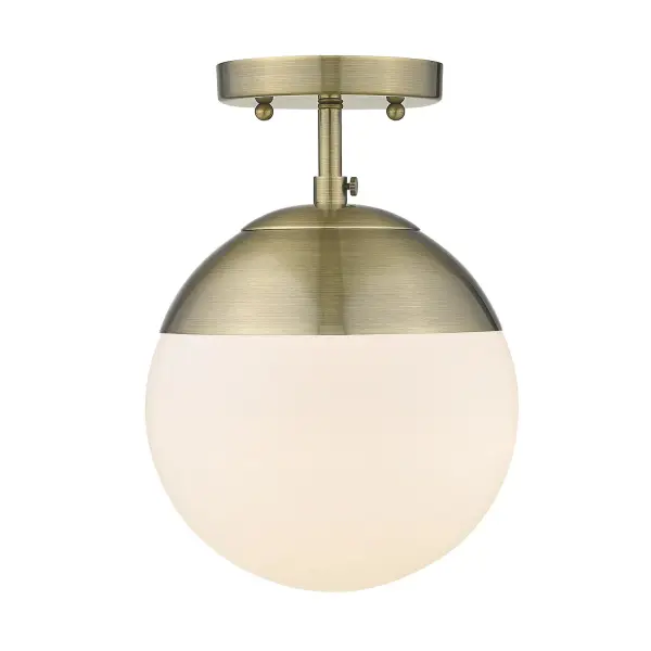The Dixon semi-flush mount combines timeless aged brass finish with practical design for mid-height ceilings. Its compact 7.5" profile and glass shade create warm, diffused lighting perfect for intimate spaces.