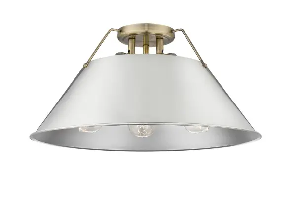 The Orwell 3-Light Flush Mount combines industrial elegance with practical design, perfect for spaces with low ceilings. The aged brass finish and pewter metal shade create warm, diffused lighting with vintage appeal.