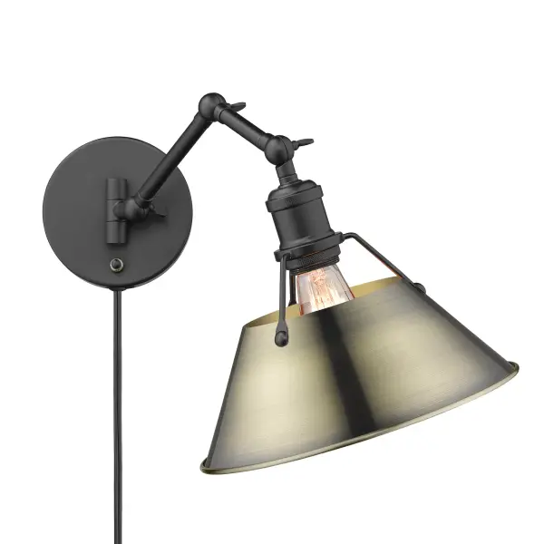 The Orwell swing arm wall lamp combines industrial elegance with practical functionality. Its adjustable arm and height make it perfect for reading or task lighting, while the matte black and aged brass finish adds vintage charm.
