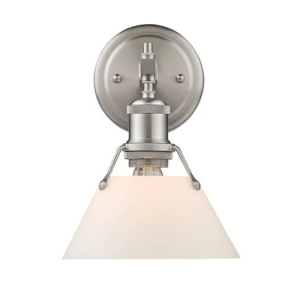 Bring industrial elegance into your home with the Yep by Golden Lighting Orwell 1-light Vanity in Pewter and Opal Glass. Featuring a glass shade and a pewter frame, it creates a welcoming atmosphere. The opal glass shade, with its milky, translucent white color and smooth, satin-matte finish, diffuses light evenly for a soft, glare-free glow. This timeless and elegant shade adds a touch of sophistication to any decor. The pewter finish offers understated charm with a durable electroplating process, creating a beautiful satin lustre that gently diffuses light. Suitable for damp locations, this fixture brightens up bathrooms with dedicated lighting that flatters while providing practical task illumination. Overall Dimensions: 7.5"W x 9.88"H x 8.5"D, requiring 1 E26 Medium base bulb (not included, max 100 wattage). Elevate your space with this quality fixture that combines style and function effortlessly. - alternate view