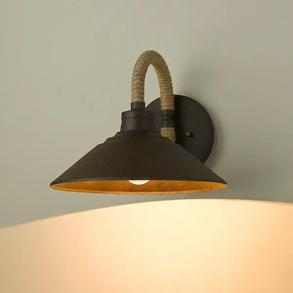 The Journey wall sconce blends rustic and nautical design with its dark rust finish and hand-wrapped natural rope details. Perfect for creating cozy ambiance in hallways, bathrooms, and bedrooms with damp location rating. - alternate view