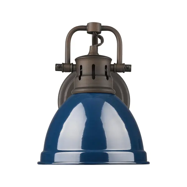 The Duncan vanity light combines rustic farmhouse charm with a sophisticated navy blue metal shade. Its adjustable directional head and damp location rating make it both practical and versatile for bathrooms and laundry rooms. - alternate view
