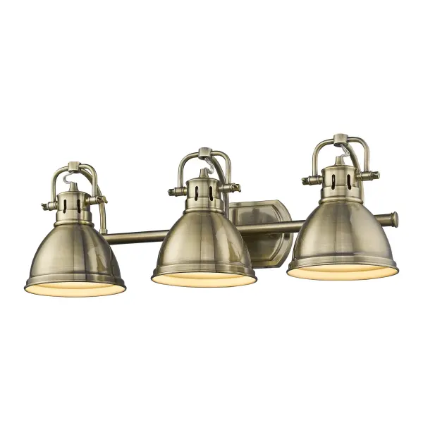 The Duncan 3-Light Vanity combines traditional farmhouse charm with practical adjustable directional heads. Its warm aged brass finish with circular brushing beautifully diffuses light, creating an inviting atmosphere in any bathroom.