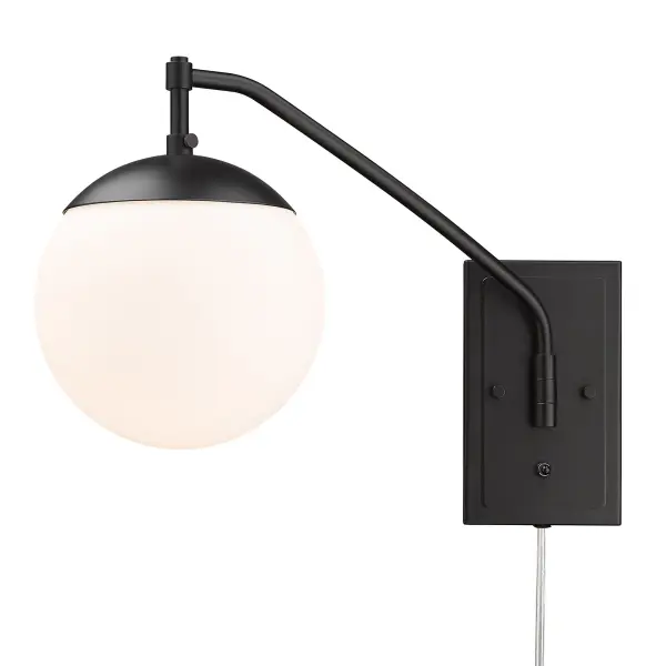 The Glenn swing arm wall lamp combines mid-century modern aesthetics with practical functionality. Its adjustable arm and opal glass shade provide directed, glare-free lighting perfect for reading or task work.
