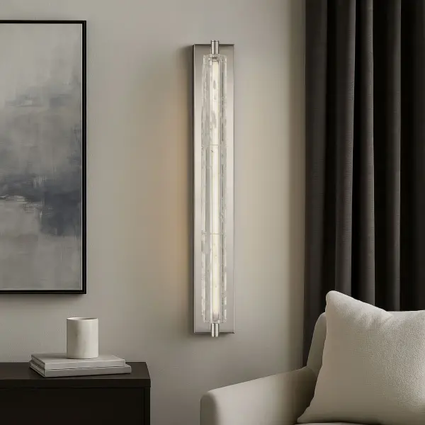 The Crystallo LED Wall Sconce combines modern elegance with exceptional functionality. Its solid crystal cylinder shade with white inclusions creates captivating light diffusion, while the polished nickel finish adds luxurious appeal. - alternate view