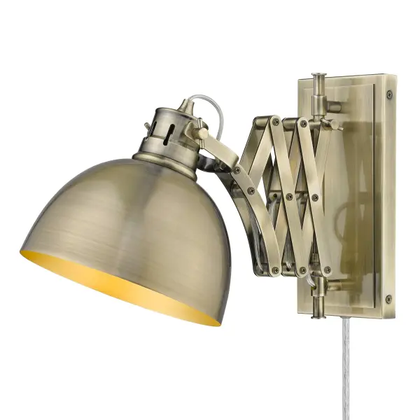 Bring industrial elegance into your home with the Wry Lighting Hawthorn 1-light Swing Arm Wall Lamp. Featuring a metal shade and an aged brass frame, it creates a welcoming atmosphere. The metal shade beautifully supports the light, showcasing a finely-spun circular brushed texture that diffuses light, adding depth and character to its illumination. Embrace timeless appeal with our Aged Brass finish. This finish offers a warm glow, reminiscent of vintage heirlooms, crafted through a durable electroplating process that enhances depth and history. Perfect for bedrooms and home offices, this fixture is damp location rated, suitable for covered areas with occasional moisture. Its convenient swing arm allows for easy adjustment, with heights ranging from 10" to 16" to focus light where needed. Overall Dimensions: 7.88"W x 10"H x 12.25"D. Requires 1 E26 Medium base bulb (not included), with a maximum wattage of 100. This stylish wall lamp combines high-quality functionality with an appealing aesthetic, making it an ideal choice for your home. Collection: Hawthorn Rooms: Bath,Living,Hall,Accent Finish: Aged Brass Glass: Aged Brass Notes: Fixture offers plug-in and hardwire installation options. Lock fixture arms and shade using thumbscrews. Dimension: 7.875``W x 10``H x 12.25``E (min.) - 7.875``W x 16``H x 23.75``E (max.) Width: 7.88" Height: 10.00" Weight: 5.51 lb Extension from Wall: 12.25" Wire: 8`` Canopy: 4.75"W x 9.75"H x 0.75"D Number of Bulbs: 1 Maximum Wattage: 100.00 W Bulb Type: A19 Bulb Base: E26 Light Source: Incandescent Dimmable Voltage: 120.00 V Material: Steel Country of Origin: China Safety Listing: ETL Safety Rating: Damp Connection: Hardware Manufacturer Warranty: 1 Year Limited Instructions Parts Diagram